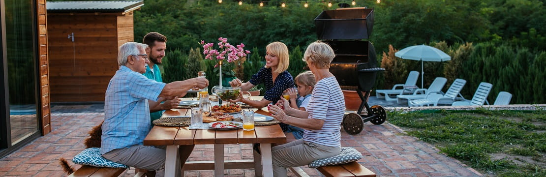 A view of several people sharing a meal at a table together
